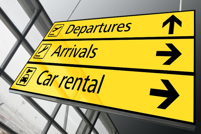Sign that says Departures, Arrivals, and Car rental with arrows pointing in the appropriate direction to symbolise appropriate wayfinding signage in airports