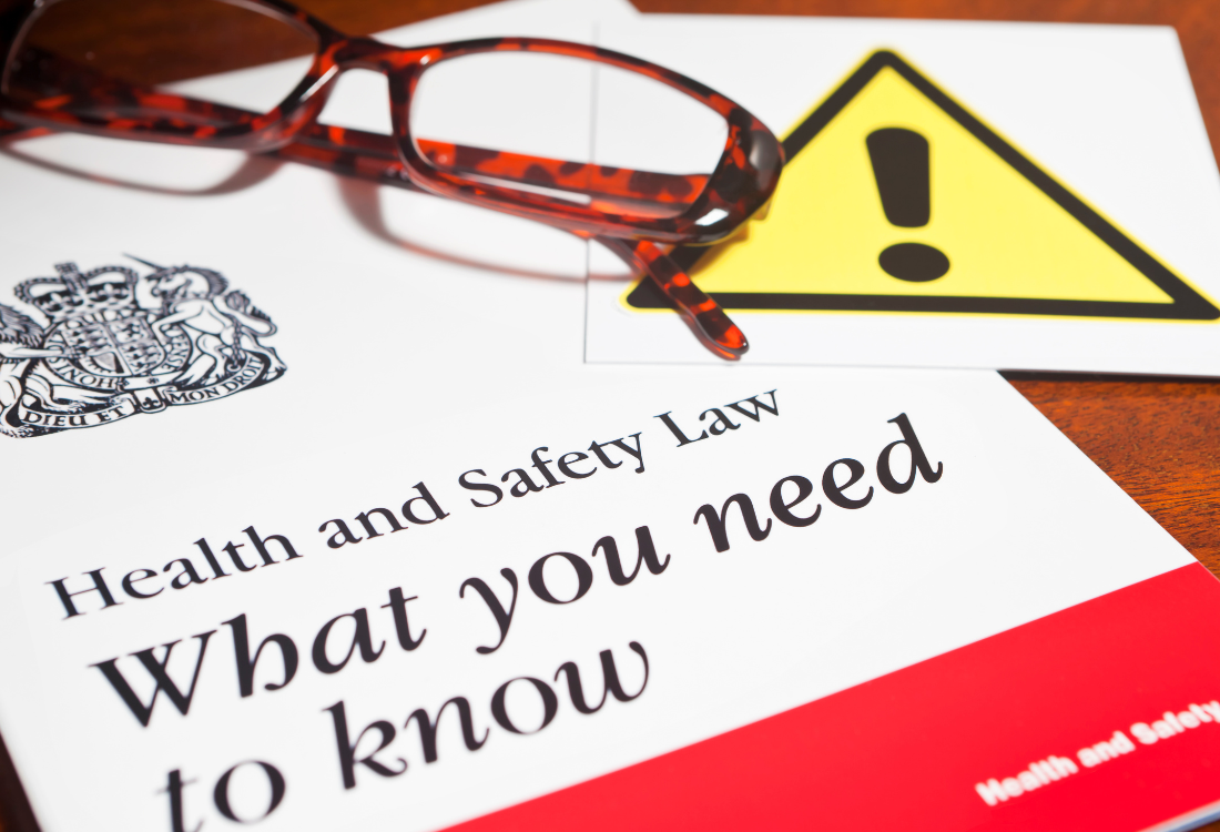 A health and safety law book highlighting the health and safety certifications needed for a signage provider. 