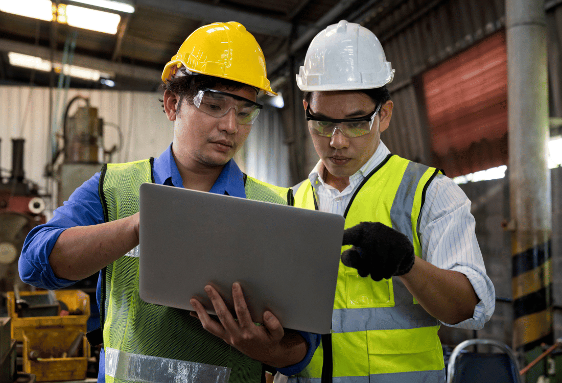 Two people reviewing the system for Image Technique's Sign Manufacturing