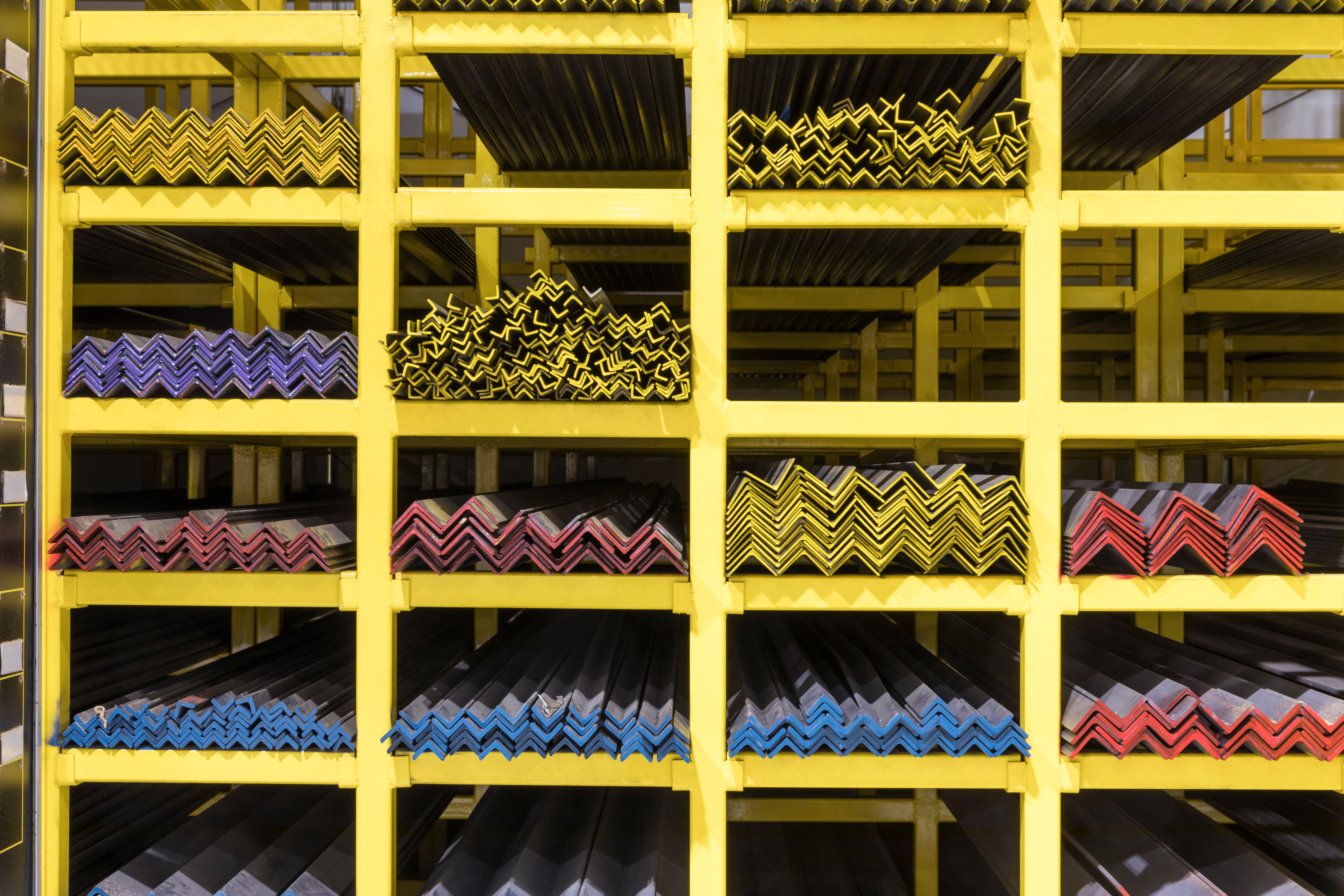 Yellow shelving holding the materials used for bespoke signage