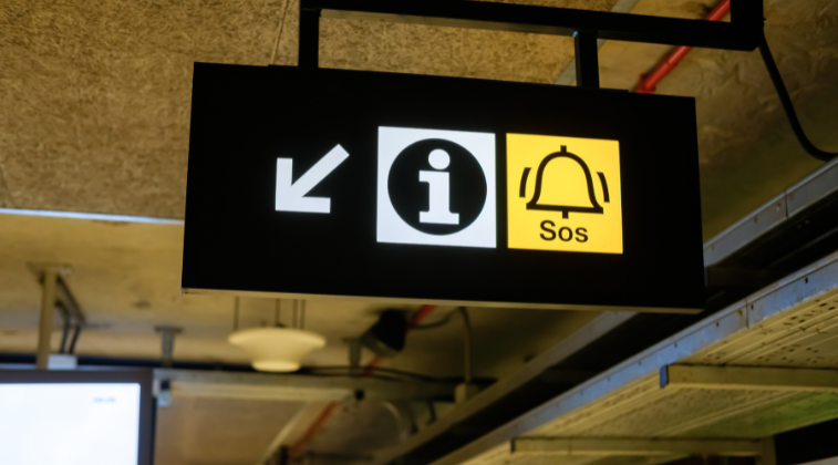 Exit and SOS sign relating to wayfinding signage